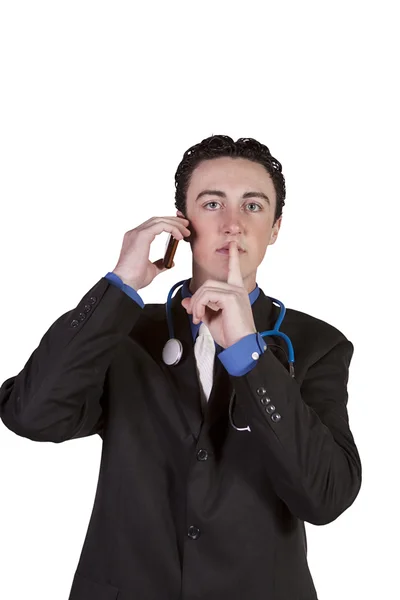 携帯電話で話している若い医者 — ストック写真