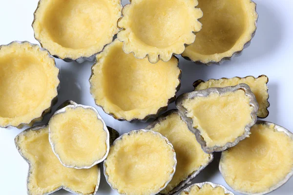 stock image Raw dough in small baking pans