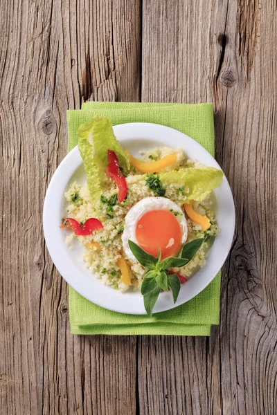 Couscous and fried egg — Stock Photo, Image