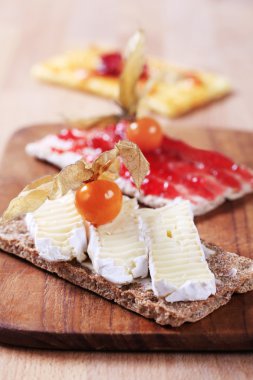 Crispbread with cheese and jam clipart