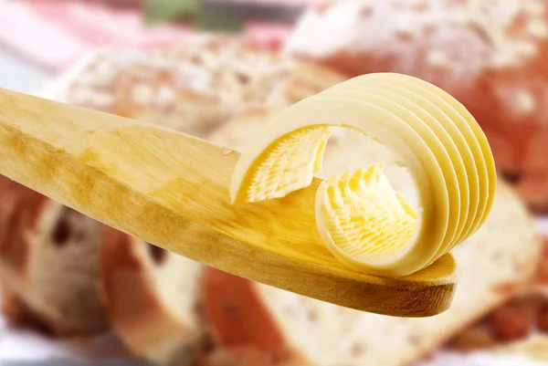 stock image Butter curl on a wooden spoon