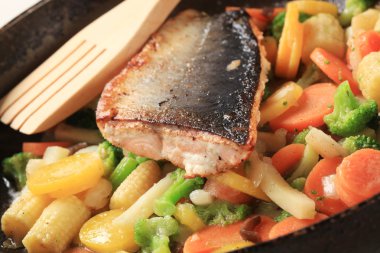 Roasted salmon trout fillet and mixed vegetables clipart