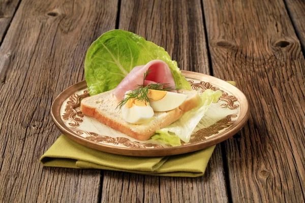 White bread with boiled egg and ham — Stock Photo, Image