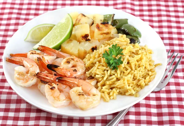 Barbecued Shrimp, rice curry, pineapple, peppers and lime. — Stock Photo, Image