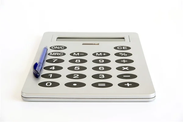 Uma calculadora muito grande sobre um fundo branco — Fotografia de Stock