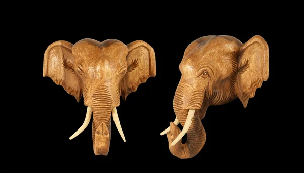 stock image Sculpture (wood) picture elephant head. Isolated on pure black