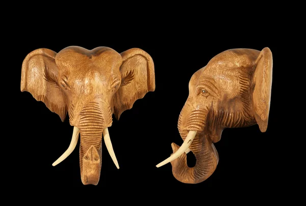 stock image Sculpture (wood) picture elephant head. Isolated on pure black