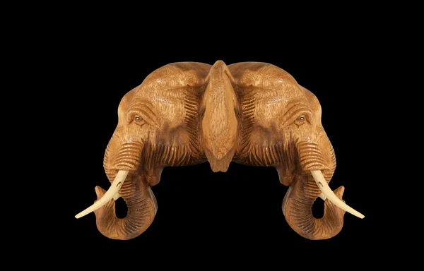 Sculpture (wood) picture elephant head. Isolated on pure black — Stock Photo, Image