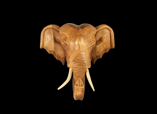 Scultura (legno) immagine testa di elefante. Isolato su nero puro — Foto Stock