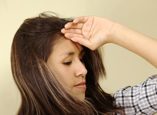 stock image Beautiful Young Woman Holding Her Forehead