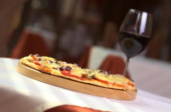 stock image Pizza on Wooden Plate