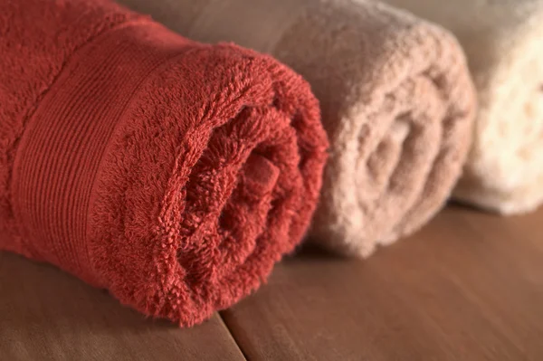 Rolled Up Towels on Wood — Stock Photo, Image