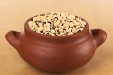 Raw Black-Eyed Peas in Rustic Bowl clipart
