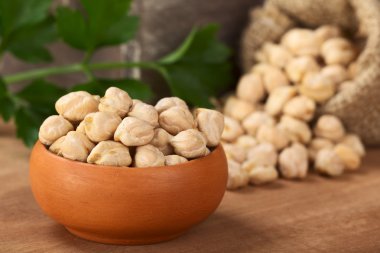 Raw White Chickpeas in Small Bowl clipart