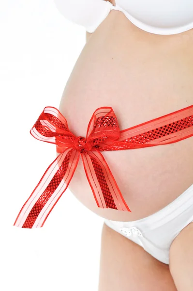 Red bow around belly — Stock Photo, Image