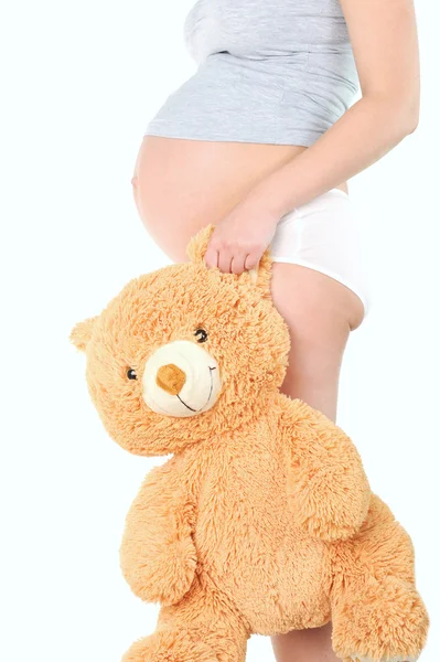 Donna incinta con giocattolo per bambini — Foto Stock