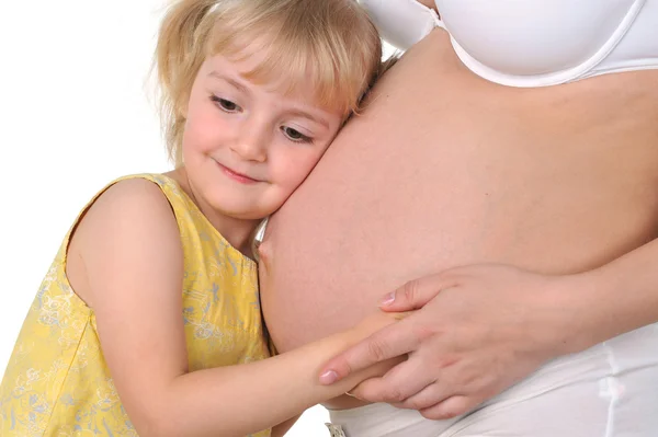 Menina com mãe grávida — Fotografia de Stock