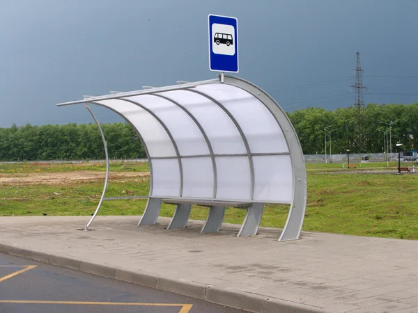 Bus stop with pavilion on asphalt road — Stock Photo, Image