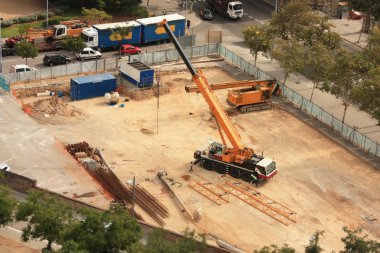 Machines working on a building site clipart