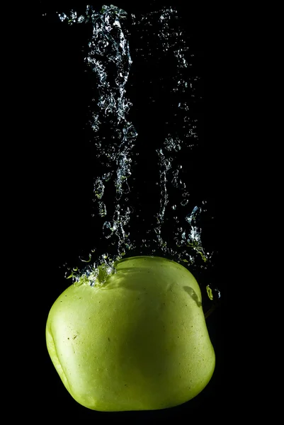 Apple falling in water. — Stock Photo, Image