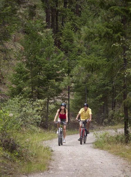 stock image Couple Cycling on Forest Trail