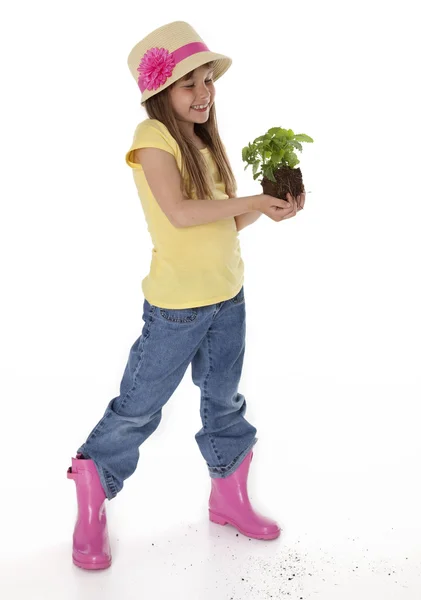 Şirin çocuk holding bitki — Stok fotoğraf