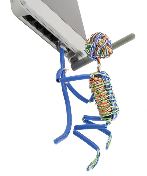 Toy little man clings to the Internet router device — Stock Photo, Image