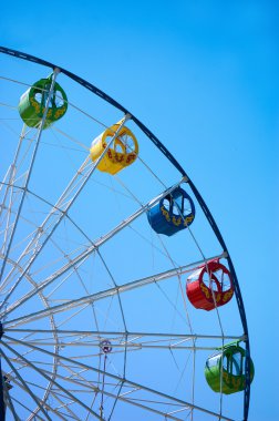 Ferris wheel on blue sky clipart