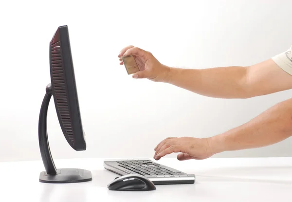 Hand sticks out computer monitor — Stock Photo, Image