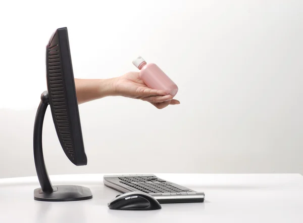 stock image Hand sticking out computer monitor