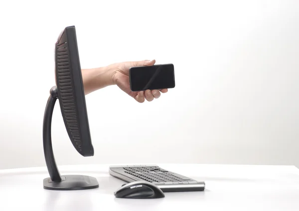 stock image Hand sticking out computer monitor