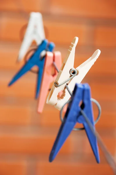 stock image Colorful clothespin hanging on a clothesline