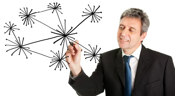 stock image Businessman drawing a social network graph