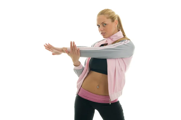 Unga kvinnor gör triceps stretch — Stockfoto