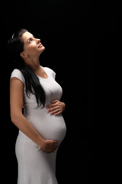 怀孕在黑色背景上 — 图库照片