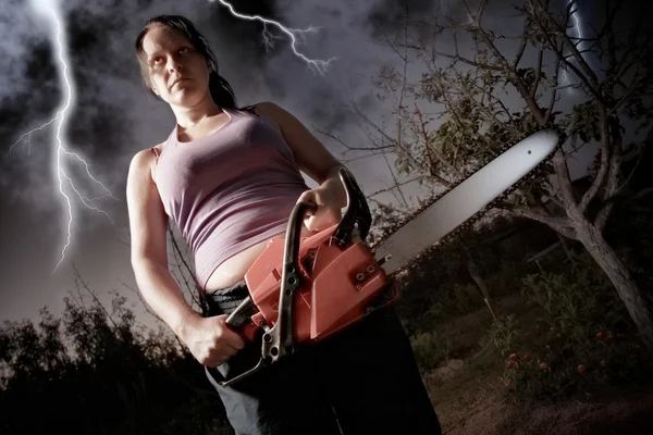 Woman with chainsaw — Stock Photo, Image