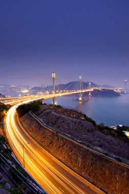 Highway and Ting Kau bridge at night clipart