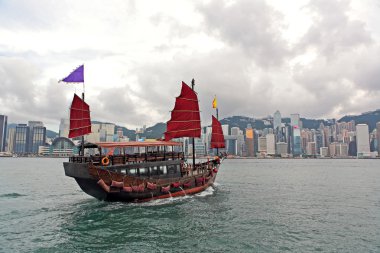 Hong Kong harbour with tourist junk clipart