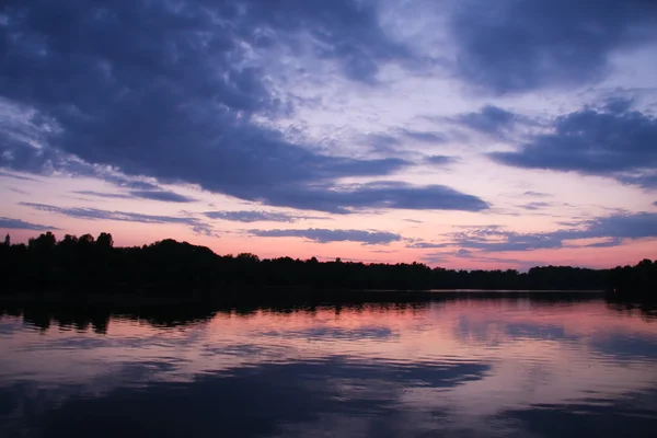 stock image Beautiful summer sunset over the river.