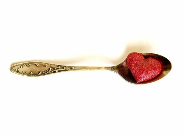 Sweet heart in old spoon — Stock Photo, Image