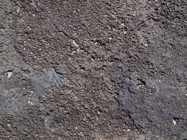 Roca de lava con trozos de arena en la parte superior — Foto de Stock