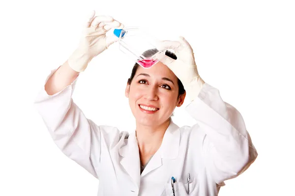 Female scientist looking at tissue culture flask — Stock Photo, Image