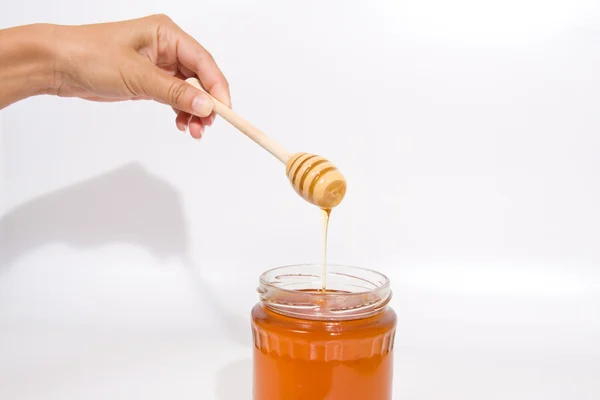 Med v dřevěnou hůl — Stock fotografie