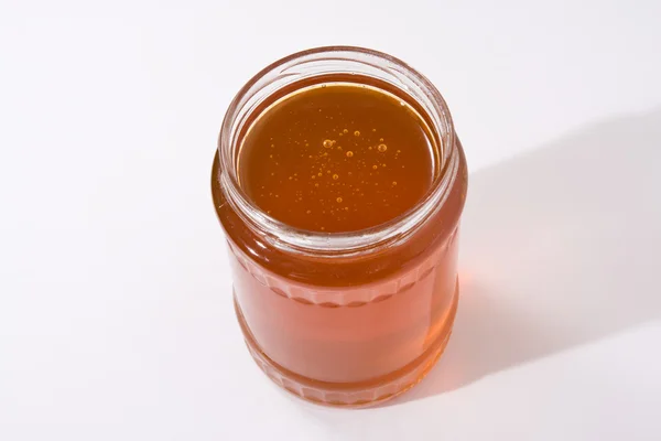 Honungsburk på vit bakgrund — Stockfoto