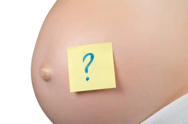 Έγκυος γυναίκα με μια κολλώδη σημείωση, η οποία πλησιάζει μια ερώτηση s — Φωτογραφία Αρχείου