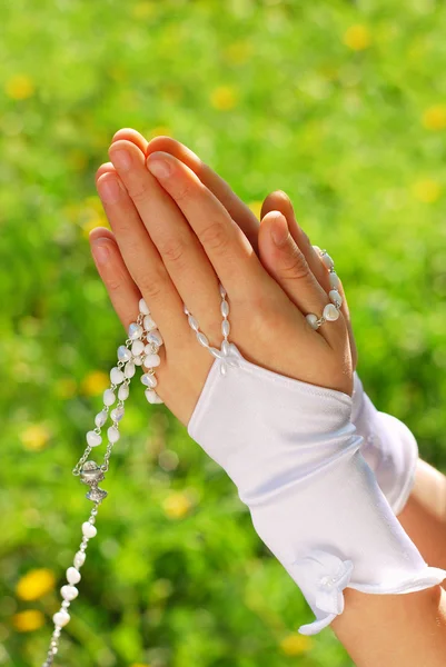 The first holy communion- rosary — Stockfoto