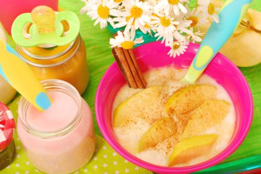 Rice pudding with with apple and cinnamon for baby clipart