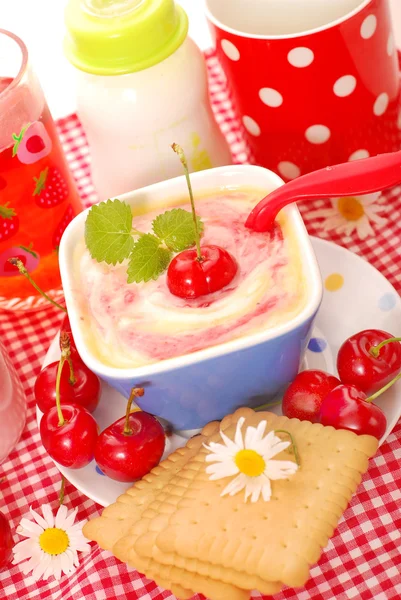 Rice pudding with with cherry for baby — Stock Photo, Image