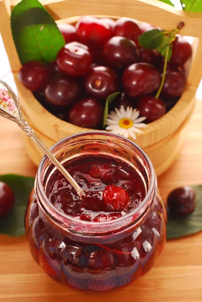 Jar of cherry confiture — Stock Photo, Image