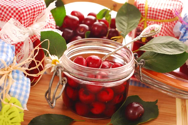 Jars of cherry compote — Stock Photo, Image